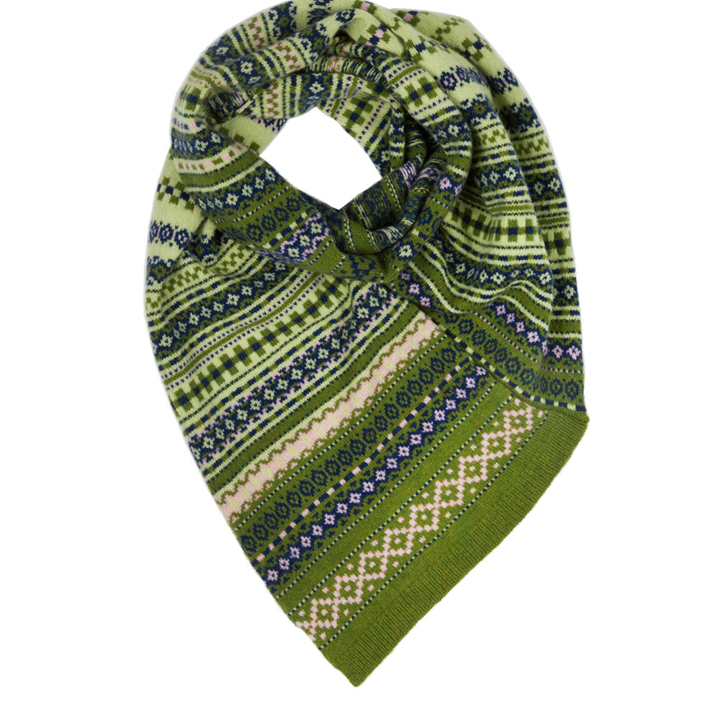 patterned twisted knitted snood in creens, blues and creams on a white background.
