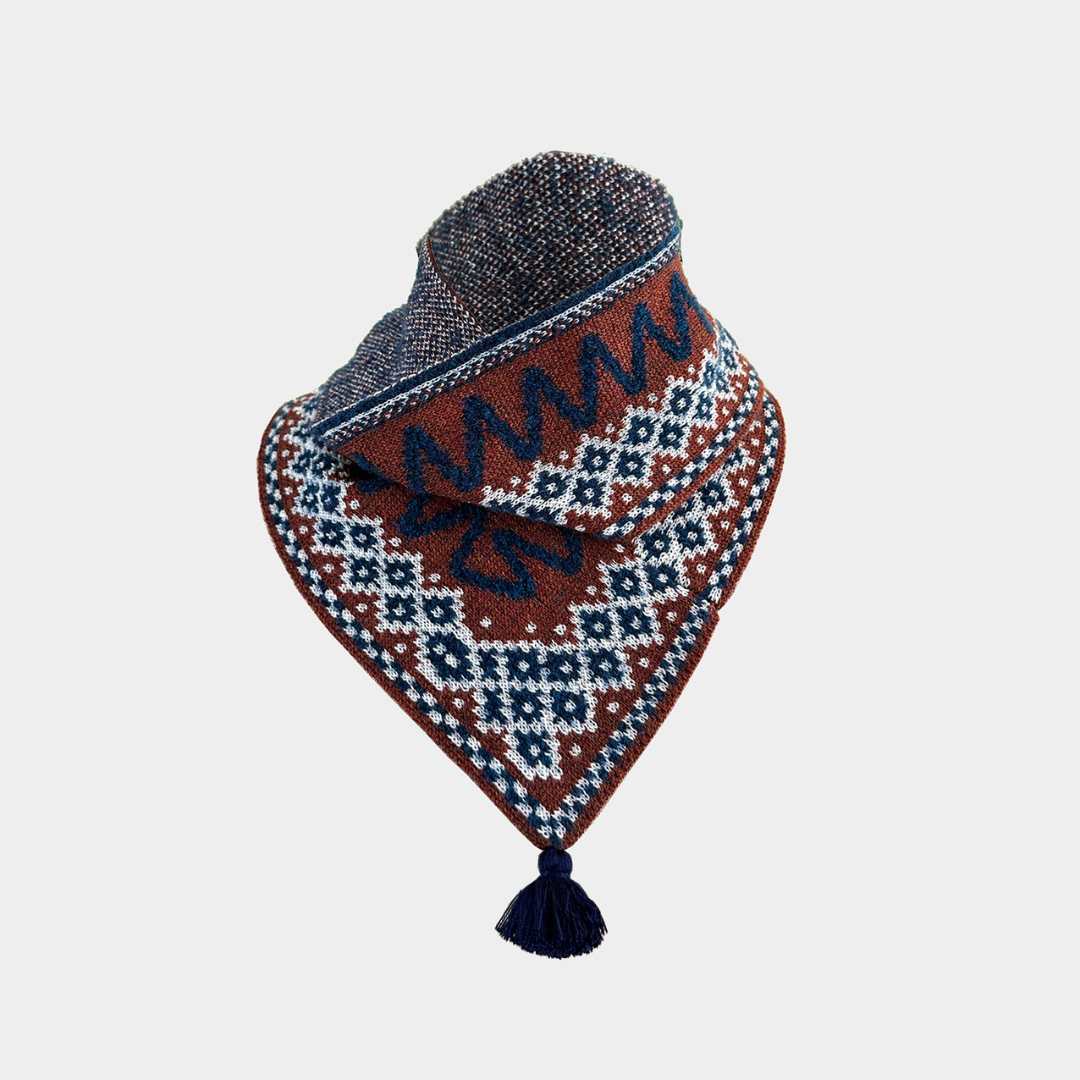 A triangular knit bandana with a tassel, featuring a brown base with navy and white geometric patterns and a dark gray textured top edge, shown on a light gray background.