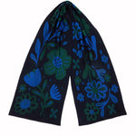 Dark blue scarf with blue and green floral patterns on a white background