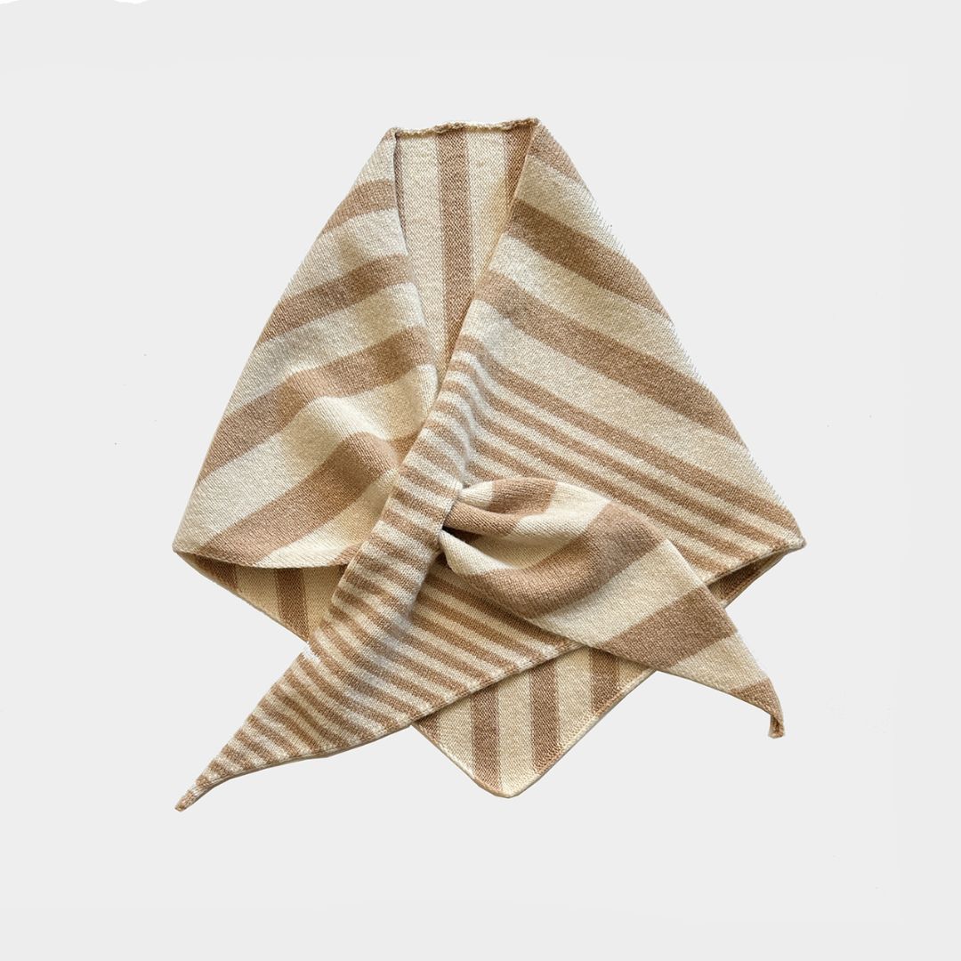 A folded striped scarf or bandana made of soft woven fabric, featuring alternating beige and light brown horizontal stripes, presented on a clean light gray background.