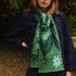 green pattered scarf word by a woman in the woods.