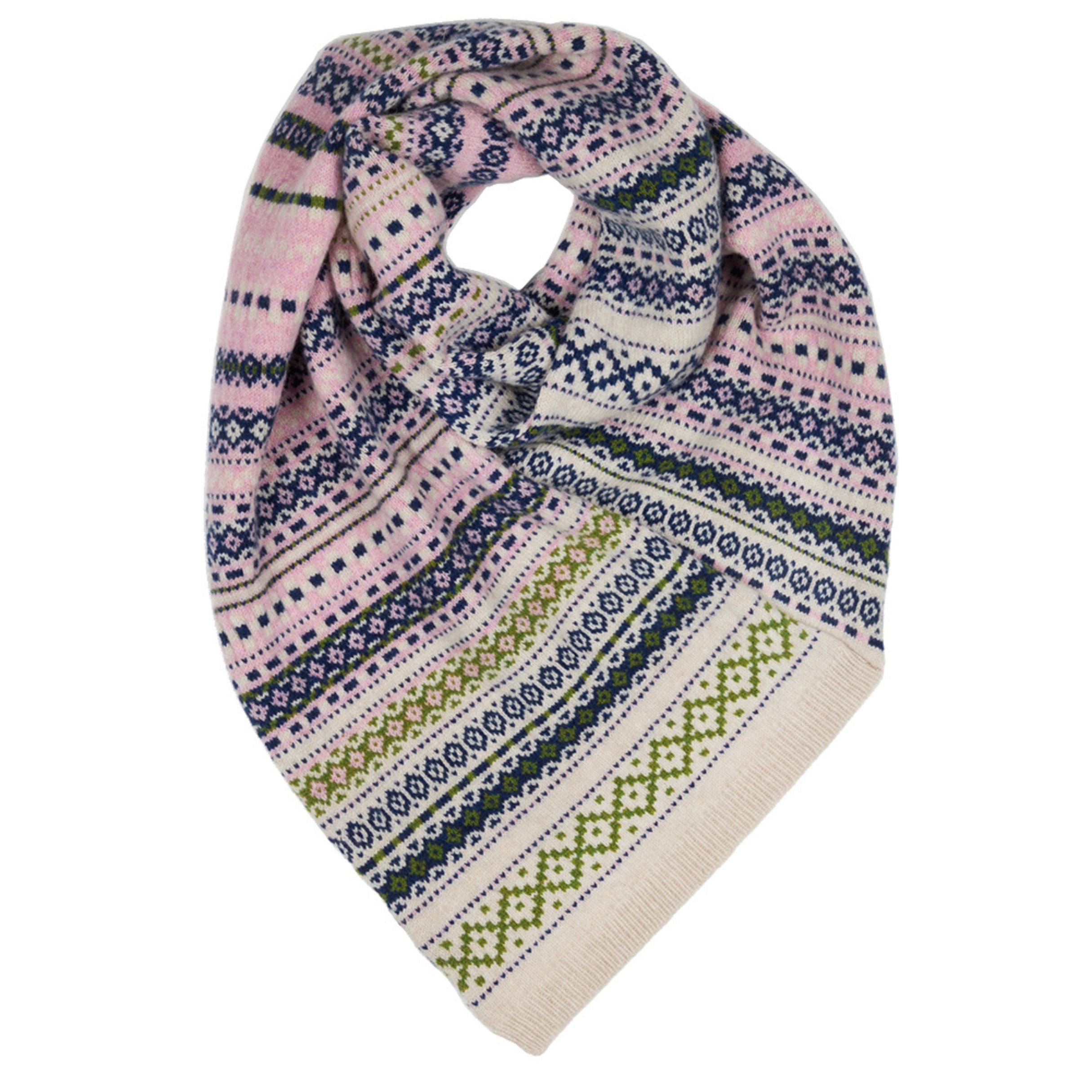 woollen twisted snood in light pinks, greens and blues worn by model in the woods.