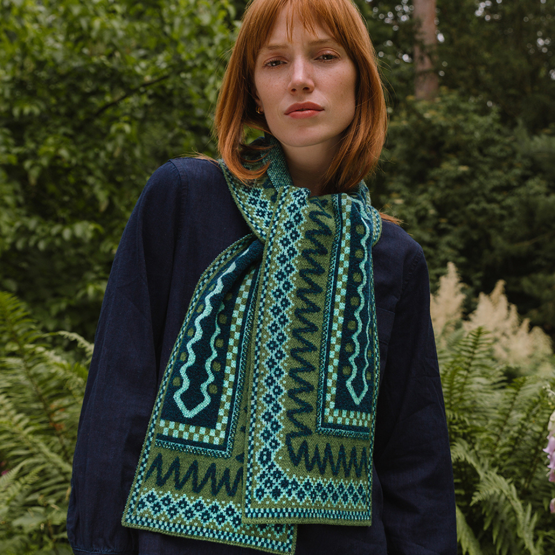 Woman wearing a patterned scarf in a natural setting