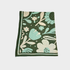 A square knitted blanket, featuring a retro floral pattern in dark green, mint green, and cream on a light gray background.