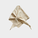 Cream knitted neckerchief on a white background.