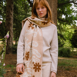 Woman wearing a floral patterned scarf in a natural setting
