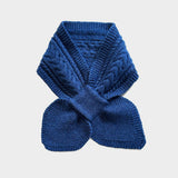 A royal blue cable-knit scarf folded and tied in a bow shape, displayed against a light gray background.