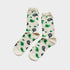 A pair of cream-colored crew socks with a green and dark blue paisley pattern, displayed against a light gray background.