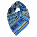 Blue patterned knitted scarf on a white background