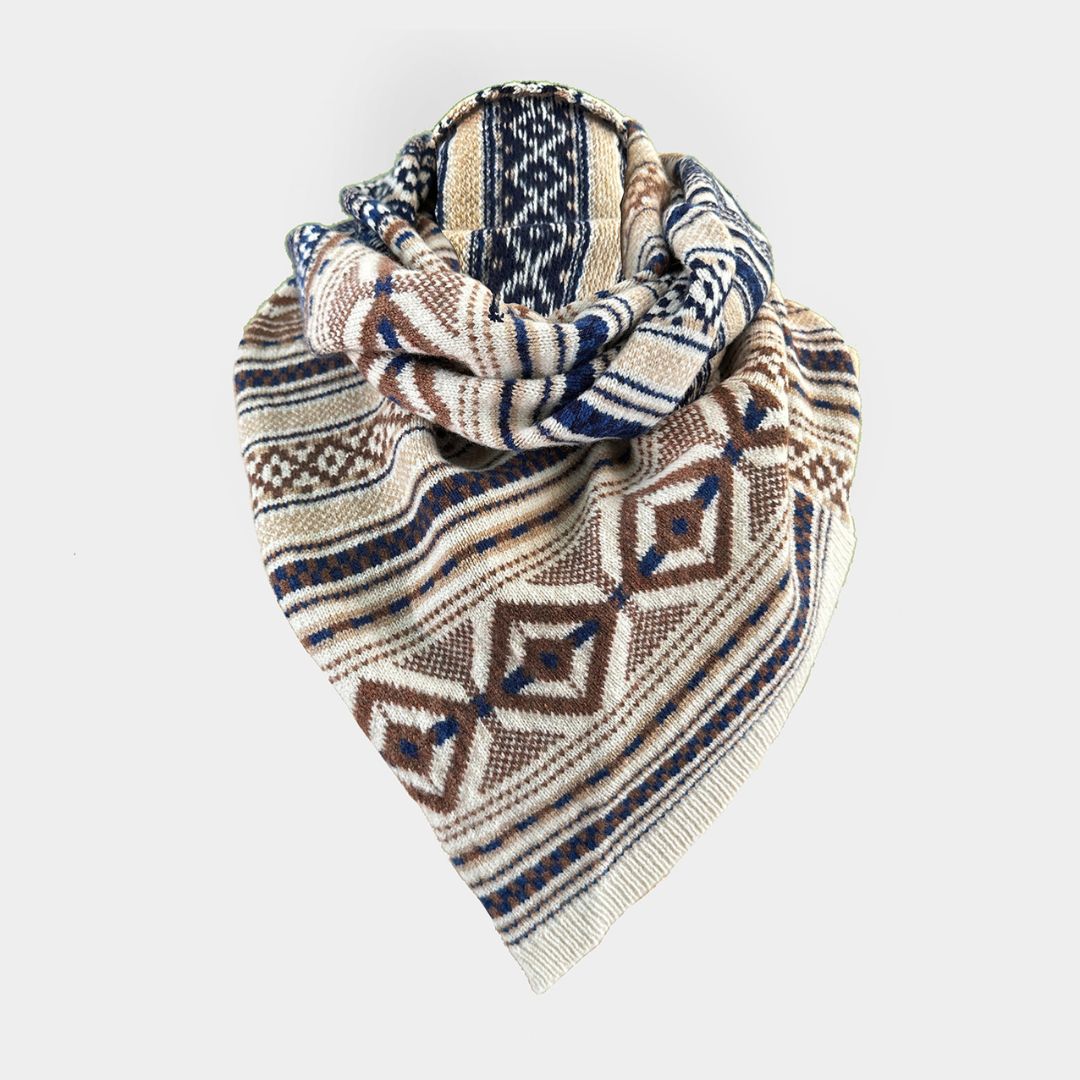 A knit triangular scarf with a geometric pattern in beige, navy blue, and brown, displayed on a light gray background.