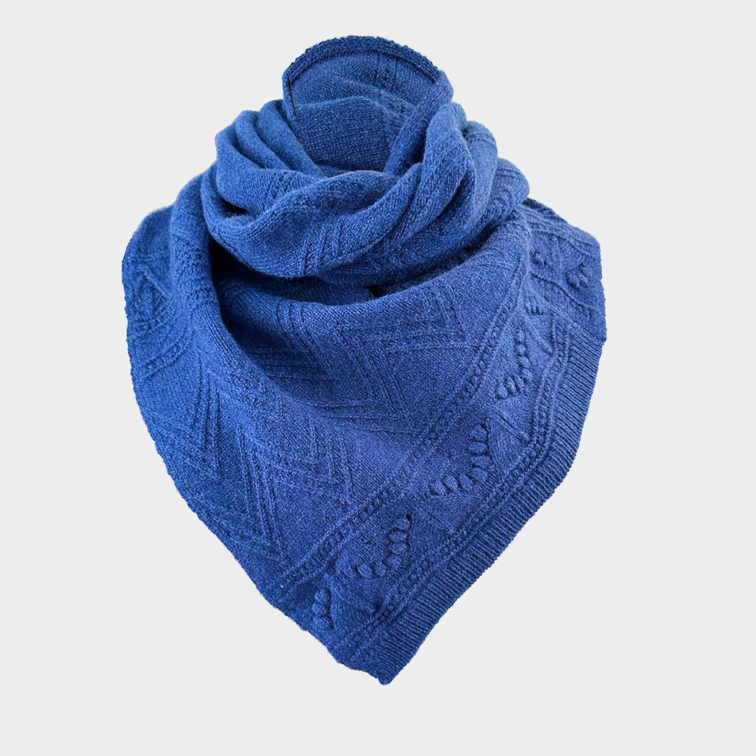 A blue textured knit bandana or scarf, folded and draped to show its pattern, on a light gray background.