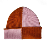 Knitted beanie with brown and pink color block design on a white background