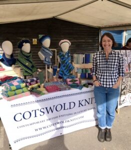 Anna standing in front of the Cotswold Knit stand at Bristol