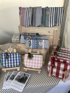 Cosmetic Purses and Pencil Cases displayed on stand